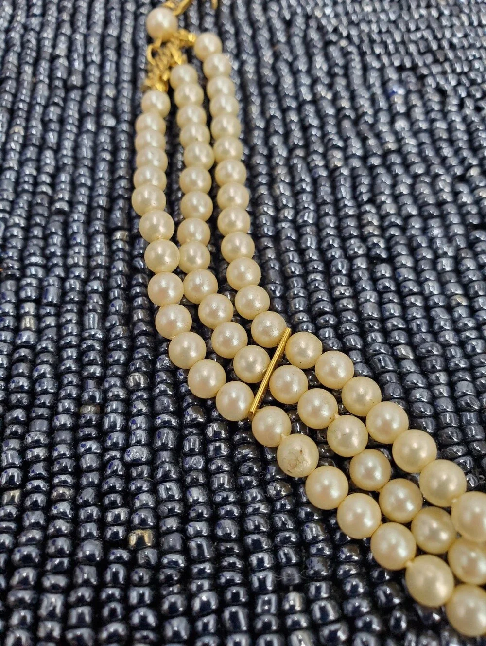 Vintage-style 3-strand pearl choker necklace with a prominent cameo centerpiece